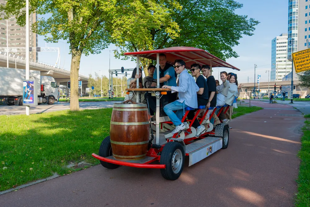 DamTours beer bike with beer barrel riding through Amsterdam